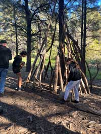 students building a tepee