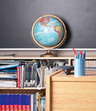 Globe sitting on bookshelf